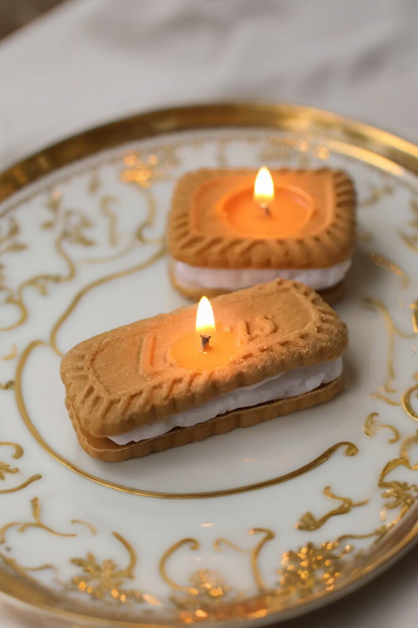 Closeup of Gingerbread Cookie Candle – square and rectangle design with cream filling.