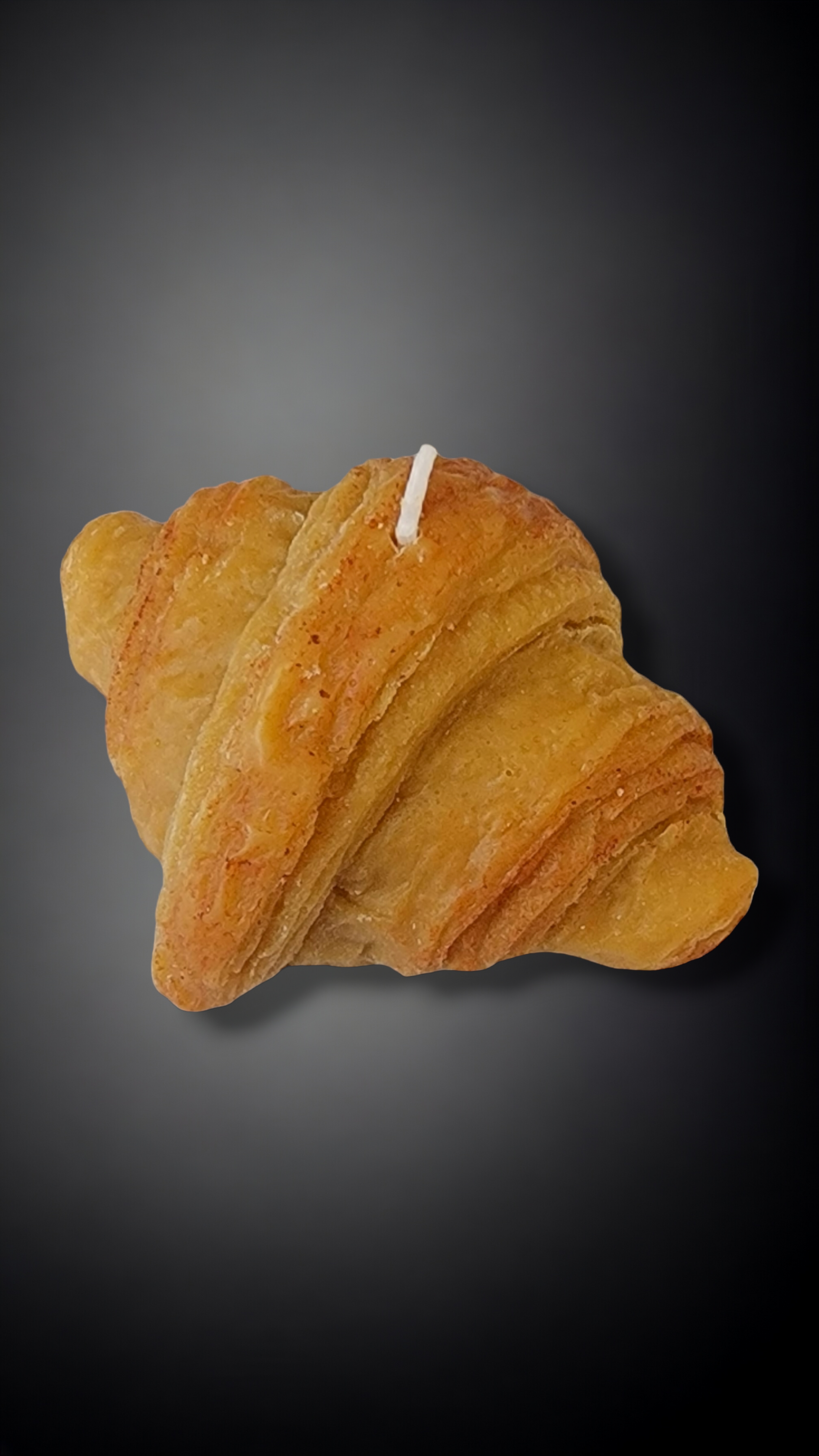 Closeup of Golden Butter Croissant Candle – flaky crust details and golden hue.