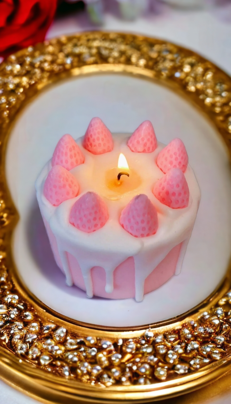 Closeup of Strawberry Rosé Cake Candle – cascading white icing and rosé strawberries.