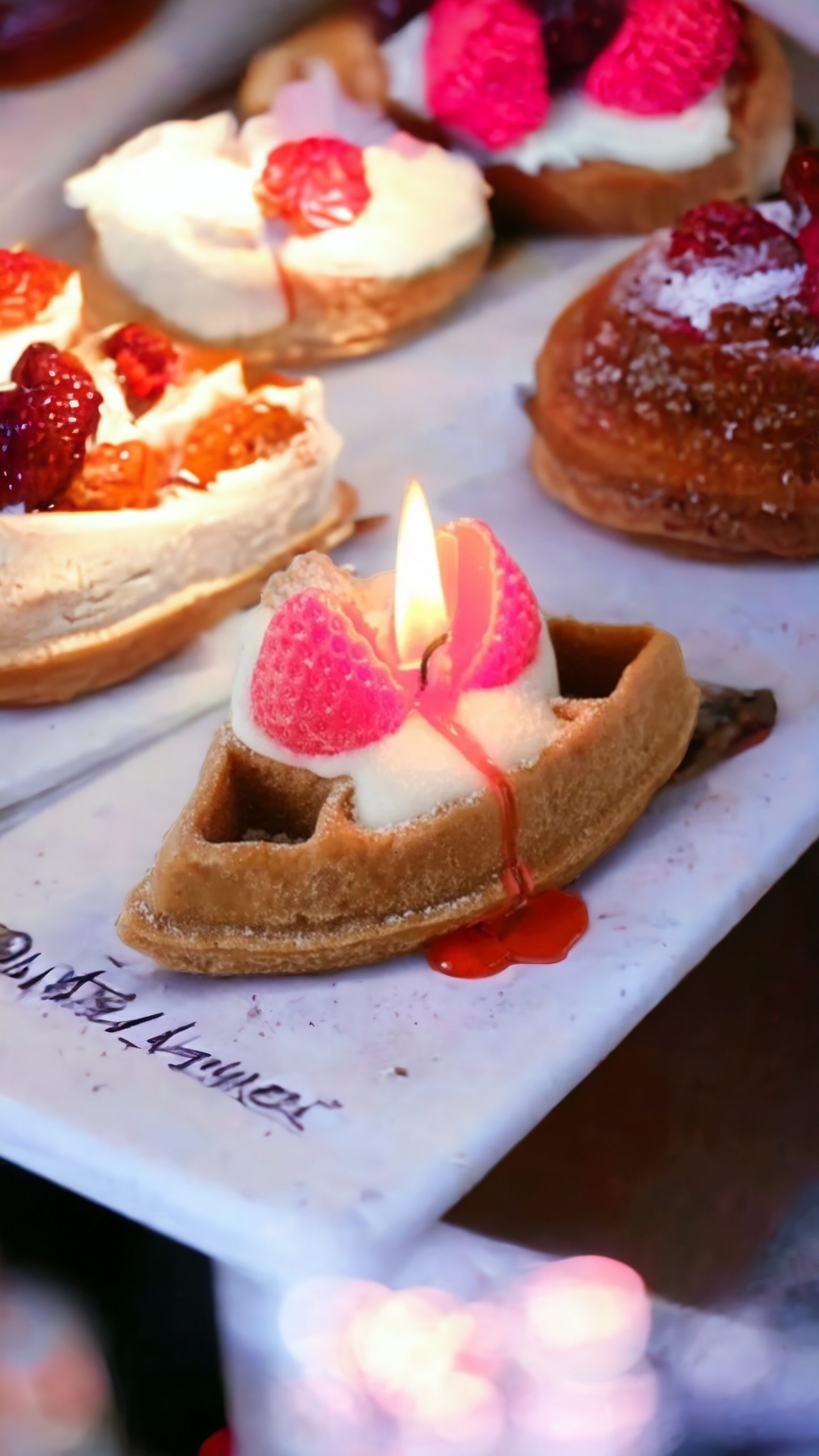 Closeup of Waffles & Cream Candle – whipped cream and raspberry topping.